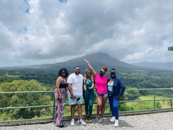 Group travelers in front of a mountain in Costa Rica 