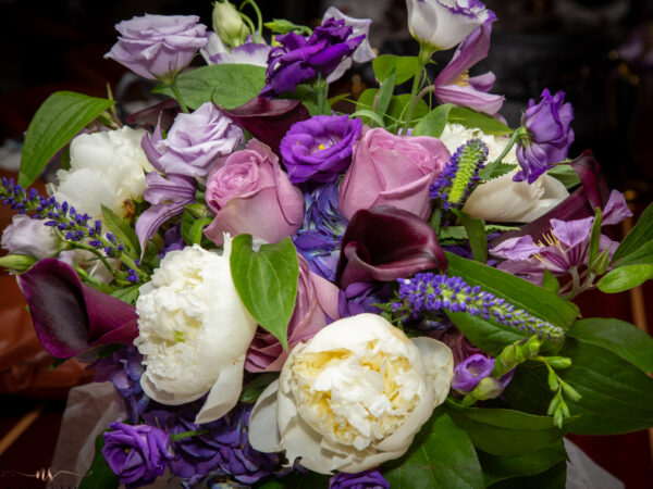 Bouquet of pink, purple, and white flowers. Destination wedding.