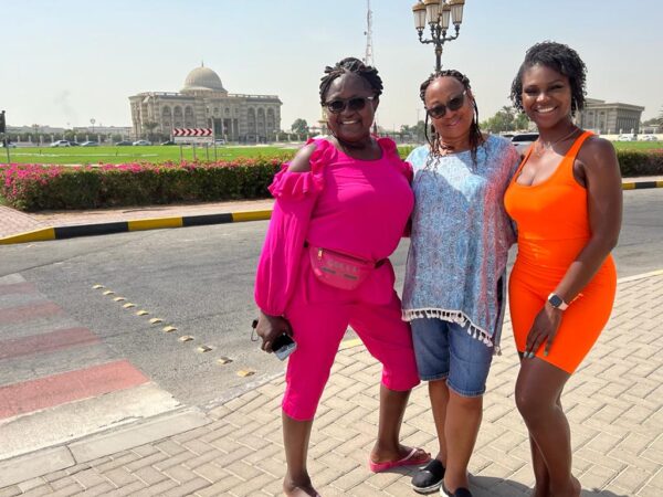 Women outside in colorful outfits enjoying the sunshine. Dreamy group travel